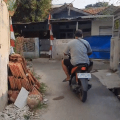 Everyday street life in an East Jakarta residential neighborhood