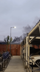 Black smoke rises over building in Arica, Chile