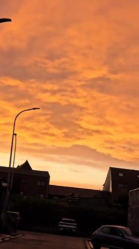 Dramatic sunset captured across residential Mouscron, Belgium