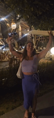 Woman poses at outdoor restaurant in Kuta Selatan