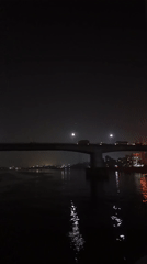 Nighttime bridge activity documented in Mirerbag, Bangladesh