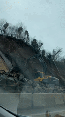 Excavator breaks rocks at Montenegro construction site