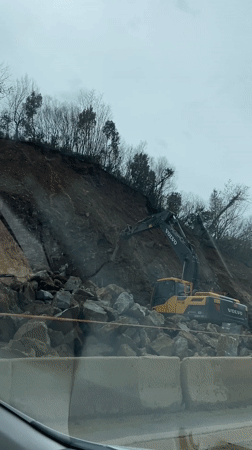 Excavator breaks rocks at Montenegro construction site