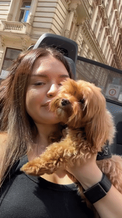Selfie session with a small fluffy dog in Prague