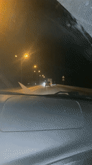 Nighttime highway traffic captured from car interior in Russia