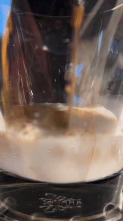 Coffee poured into milk glass captured in Berlin