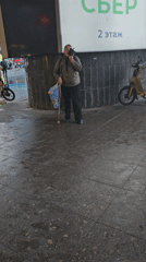 Street performer sings in Khimki amid urban documentation
