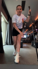 Woman stretches at gym bar in Tivat Montenegro