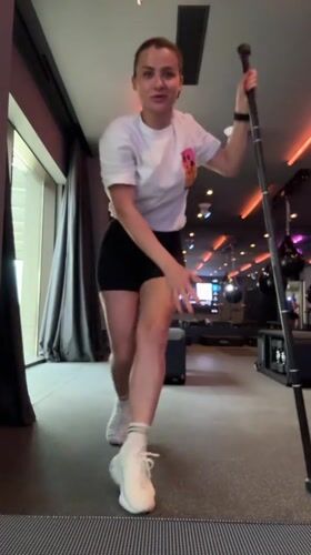 Woman stretches at gym bar in Tivat Montenegro