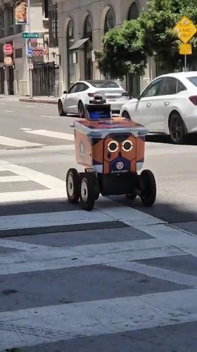 Downtown LA street life: delivery robots, rooftop work, and city views
