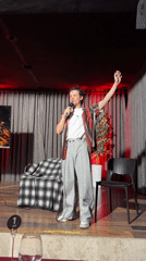Man delivers speech on stage in Tashkent