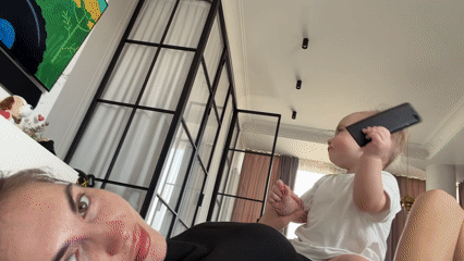 Mother and baby share quiet smartphone moment in Krasnoyarsk
