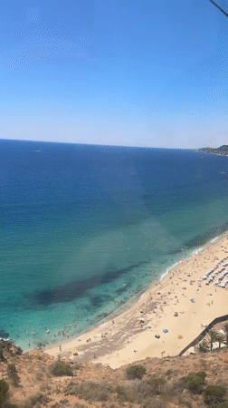 Beach crowds, castle walls, and cable car views over Alanya