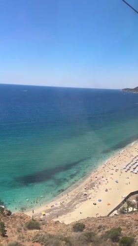 Beach crowds, castle walls, and cable car views over Alanya