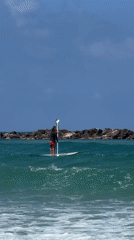Beach-goers enjoy morning water activities along Tel Aviv coast