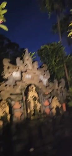 Nighttime documentation of traditional Balinese garden complex in Denpasar
