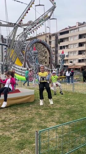 Child plays at outdoor fair in Podgorica