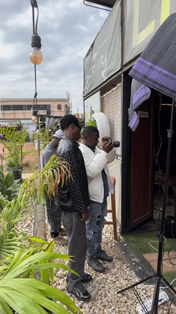 Photoshoot documented outside building in Bar Jirgi Summa, Nigeria
