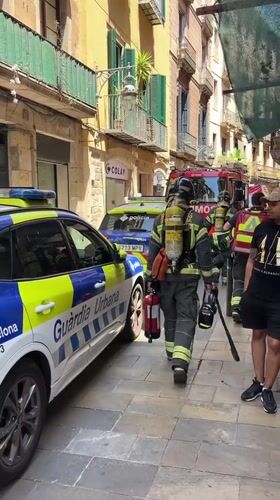 Firefighter and police respond to incident on narrow Barcelona street