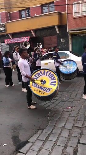 Traditional street parade with dancers and marching bands in La Paz
