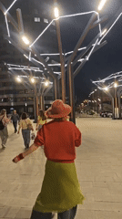 Woman in Barcelona gear tours nighttime Yekaterinburg landmarks