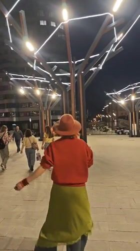 Woman in Barcelona gear tours nighttime Yekaterinburg landmarks