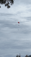 Paragliders soar over Fethiye ultratrail event under cloudy skies