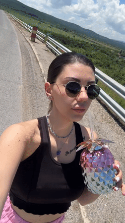 Woman poses for photos at scenic Bulgarian overlook