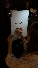Caricature artist at work on Belgrade pedestrian street at night