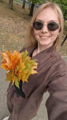 Autumn leaf bouquet selfies in a Sterlitamak park