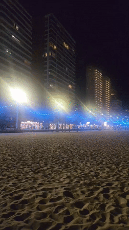 Nighttime beach scene captured in Benidorm, Spain