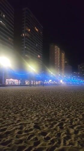 Nighttime beach scene captured in Benidorm, Spain