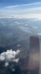 Aerial footage captures daytime view over Vils, Austria from airplane