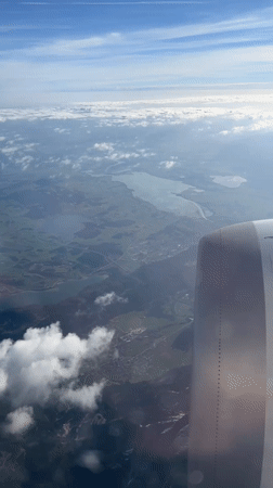 Aerial footage captures daytime view over Vils, Austria from airplane