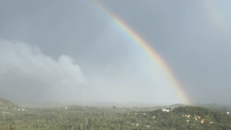 Double rainbow appears over misty Koh Phangan landscape