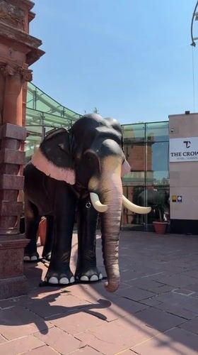 Giant inflatable elephant on a London tiled pathway