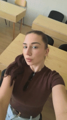 Woman takes selfies in Bulgarian classroom during morning session