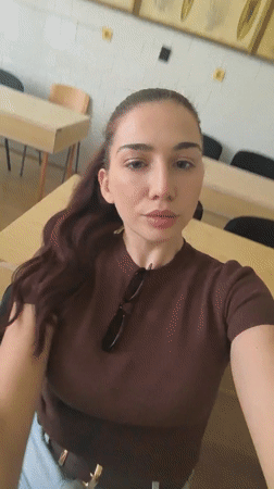 Woman takes selfies in Bulgarian classroom during morning session