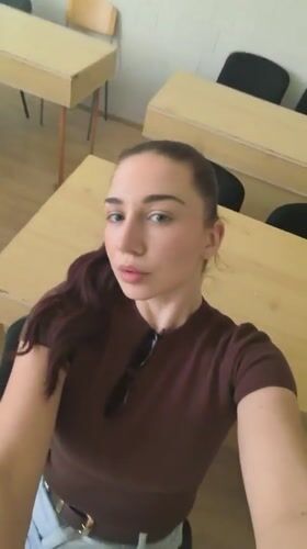 Woman takes selfies in Bulgarian classroom during morning session