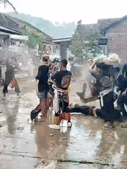 Cultural performance staged in waterlogged outdoor venue