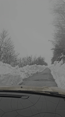 Driver navigates snowy road conditions in Cetinje, Montenegro