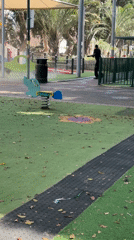 Man operates sprayer producing white mist in Netanya park