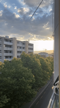 Renens evening light: balcony views and street-level architecture