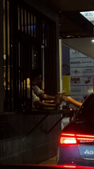 Night drive-thru transaction captured in Tlaxcalancingo, Mexico