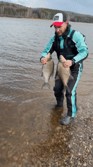 Angler in fishing gear spotted at water's edge near Chaikovsky