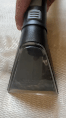 Person Uses Upholstery Cleaner on Textured Surface in Bulgaria
