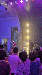 Theatrical performer and formal speakers share a stage in Astana