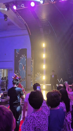 Theatrical performer and formal speakers share a stage in Astana