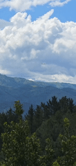 Aircraft spotted over Hondarribia's green mountains and cityscape