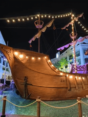 Nha Trang beachfront at night: sculptures, pirate ship, and beach bars
